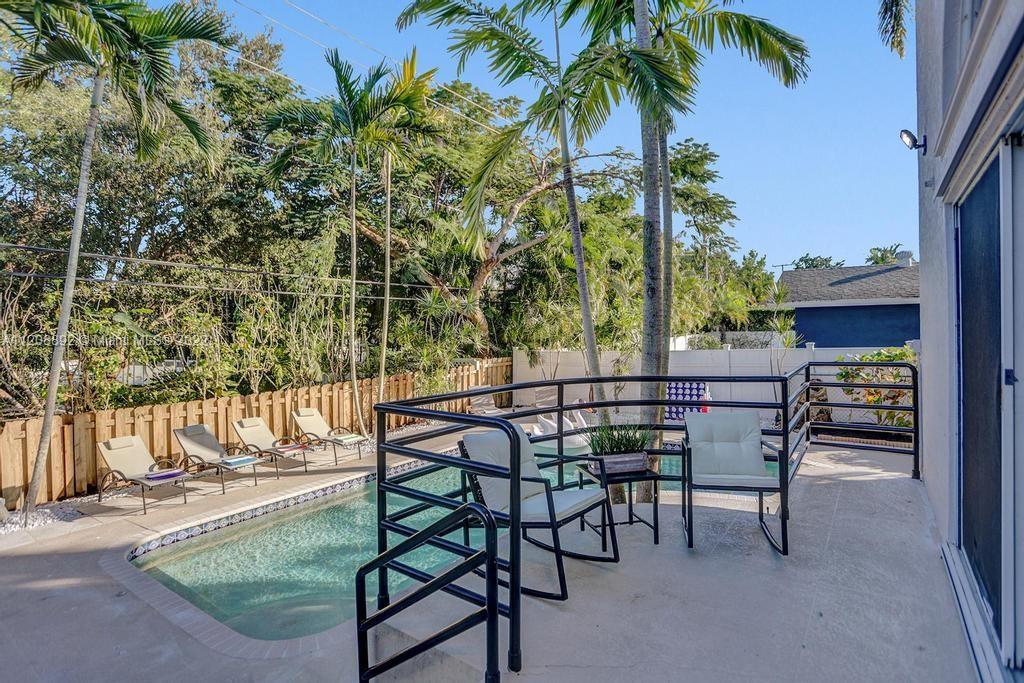 960 Northwest 4th Court Boca Raton, FL 33432 - Photo 13 of 75 a view of a chairs and table in patio