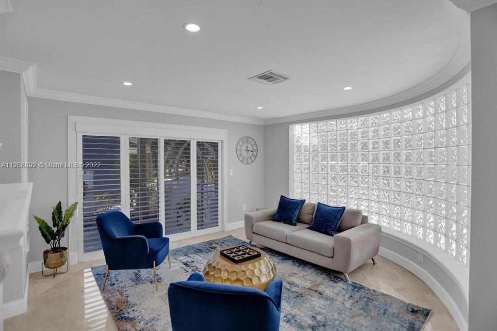 960 Northwest 4th Court Boca Raton, FL 33432 - Photo 15 of 75 a living room with furniture and a potted plant