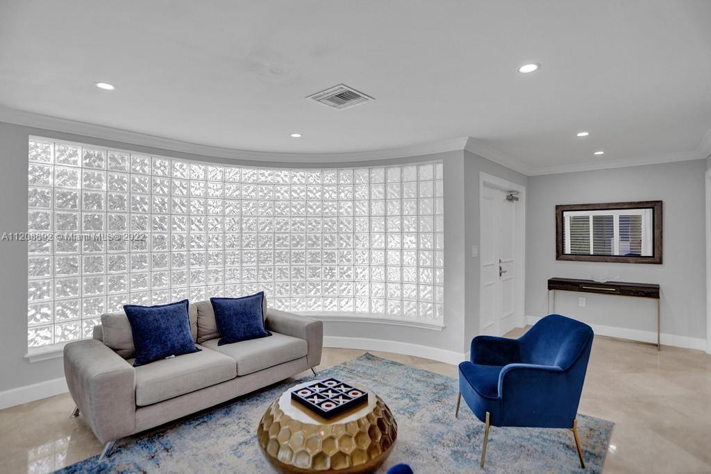 960 Northwest 4th Court Boca Raton, FL 33432 - Photo 17 of 75 a living room with furniture and a large window