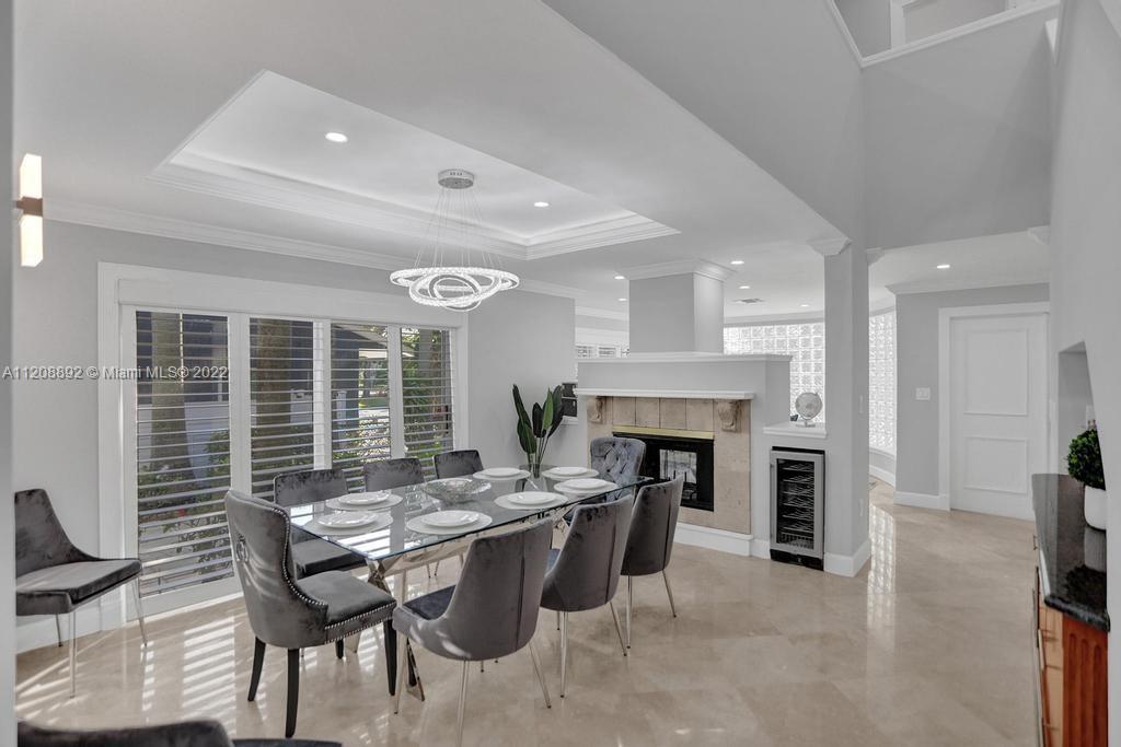 960 Northwest 4th Court Boca Raton, FL 33432 - Photo 21 of 75 a view of a dining room with furniture window and wooden floor