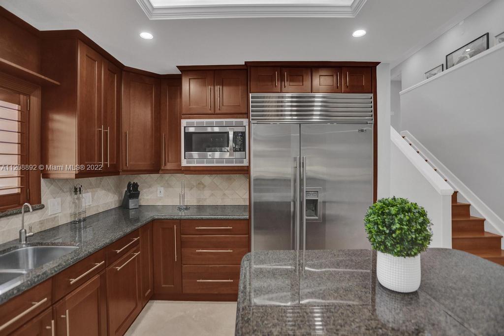 960 Northwest 4th Court Boca Raton, FL 33432 - Photo 29 of 75 a kitchen with a refrigerator and a sink