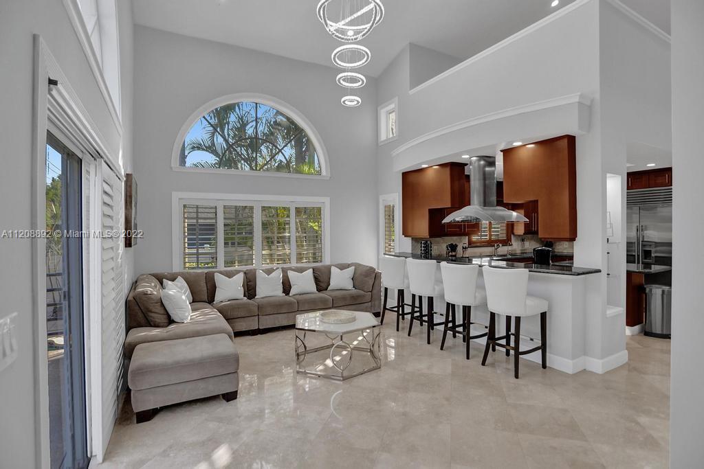 960 Northwest 4th Court Boca Raton, FL 33432 - Photo 31 of 75 a living room with furniture and a large window
