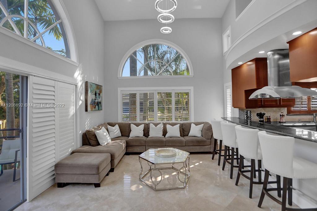 960 Northwest 4th Court Boca Raton, FL 33432 - Photo 35 of 75 a living room with furniture and a large window