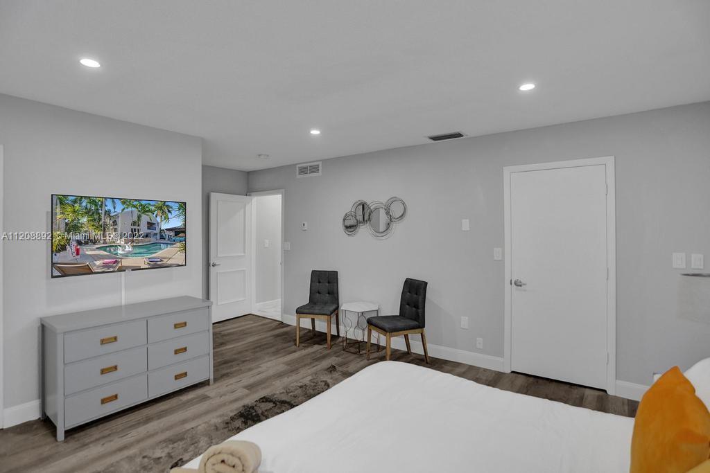 960 Northwest 4th Court Boca Raton, FL 33432 - Photo 38 of 75 a view of a workspace with furniture and wooden floor
