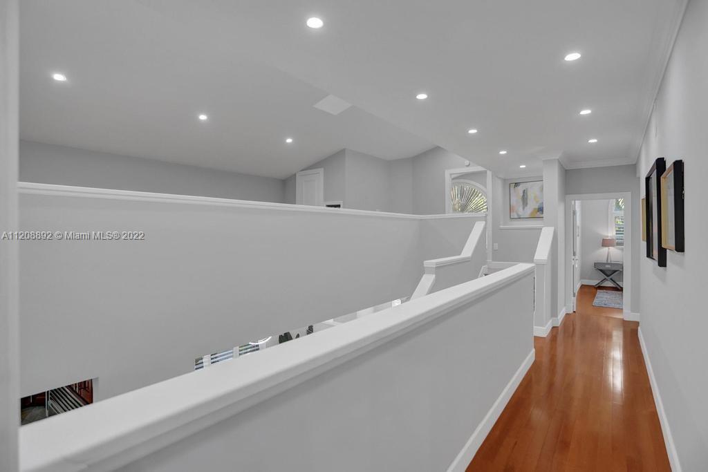 960 Northwest 4th Court Boca Raton, FL 33432 - Photo 49 of 75 a view of a big room with wooden floor and staircase