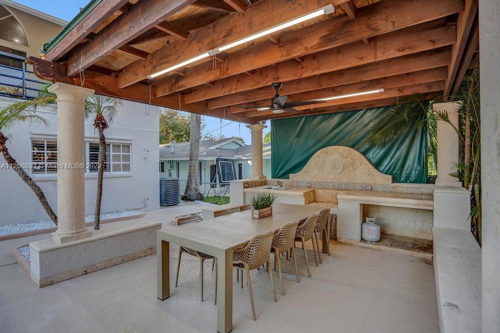 960 Northwest 4th Court Boca Raton, FL 33432 - Photo 5 of 75 a view of a patio with table and chairs
