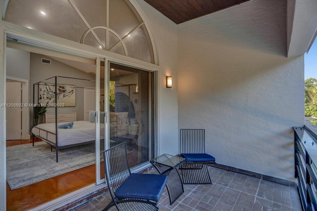 960 Northwest 4th Court Boca Raton, FL 33432 - Photo 58 of 75 a bedroom with furniture and a rug