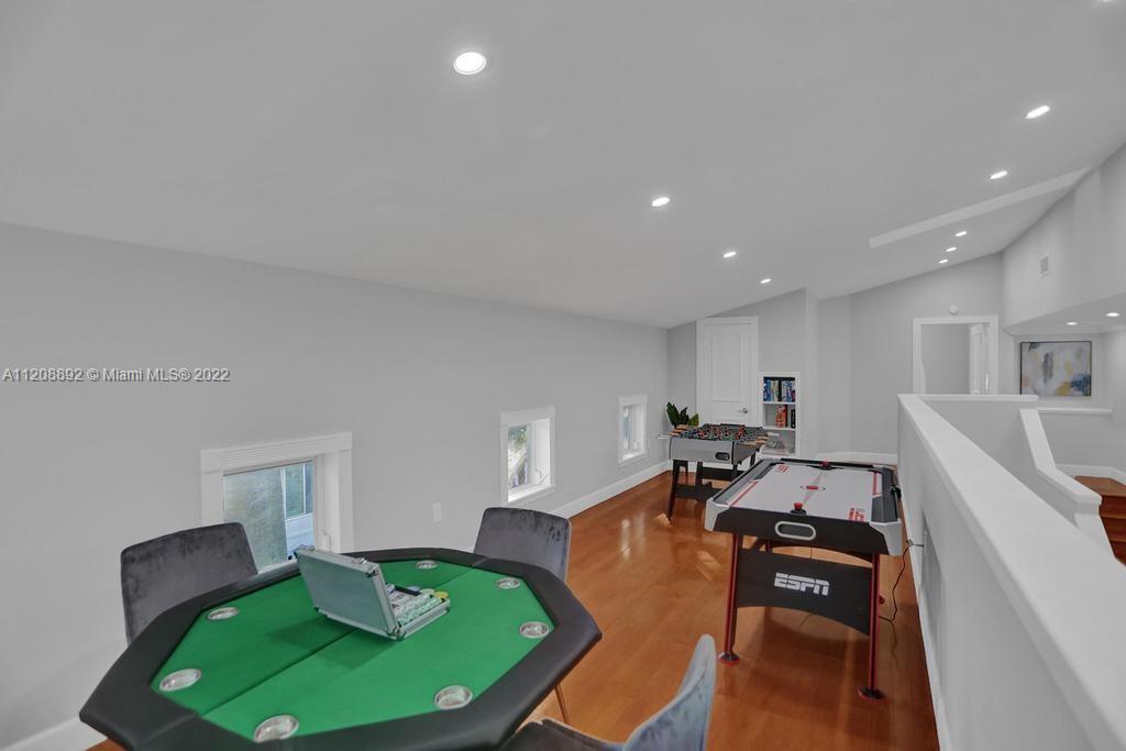960 Northwest 4th Court Boca Raton, FL 33432 - Photo 75 of 75 a living room with furniture and a wooden floor