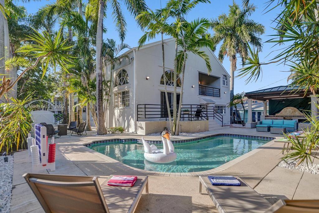 960 Northwest 4th Court Boca Raton, FL 33432 - Photo 8 of 75 a view of a house with swimming pool and sitting area