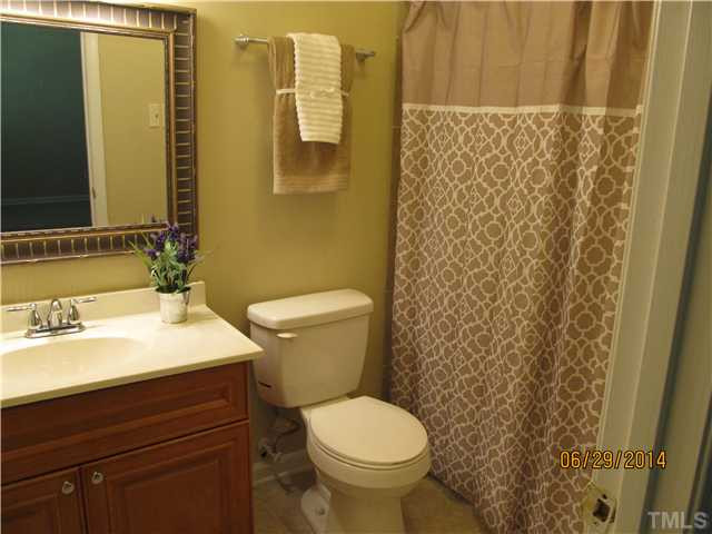 4253 Lake Ridge Drive Raleigh, NC 27604 - Photo 15 of 22 a bathroom with a sink and a toilet