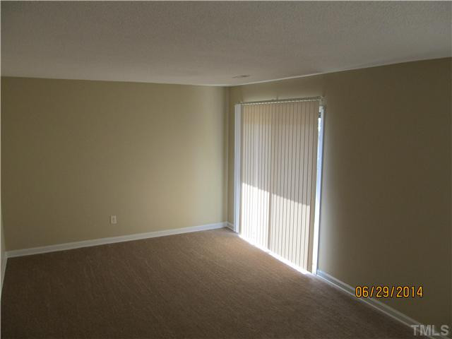 4253 Lake Ridge Drive Raleigh, NC 27604 - Photo 6 of 22 an empty room with windows