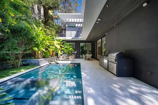 a living room with furniture a flat screen tv and a large window