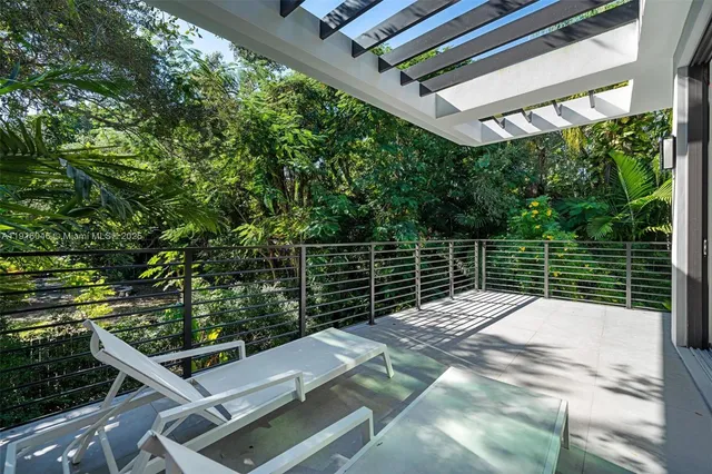 a bathroom with a tub a sink and mirror