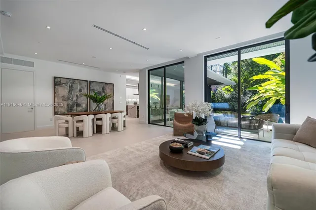 a large kitchen with kitchen island a large counter top sink and stove