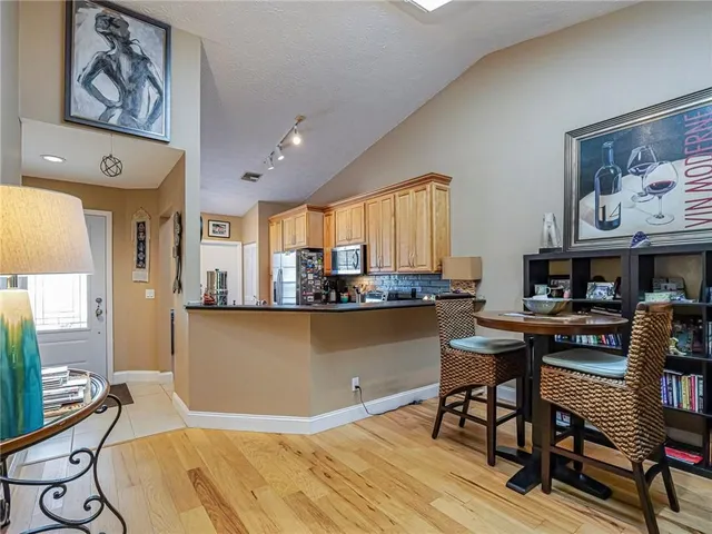 a room with furniture and a painting on the wall