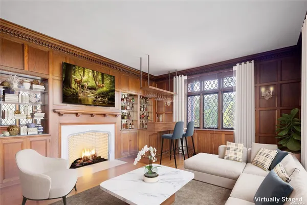 a living room with furniture a fireplace and a flat screen tv
