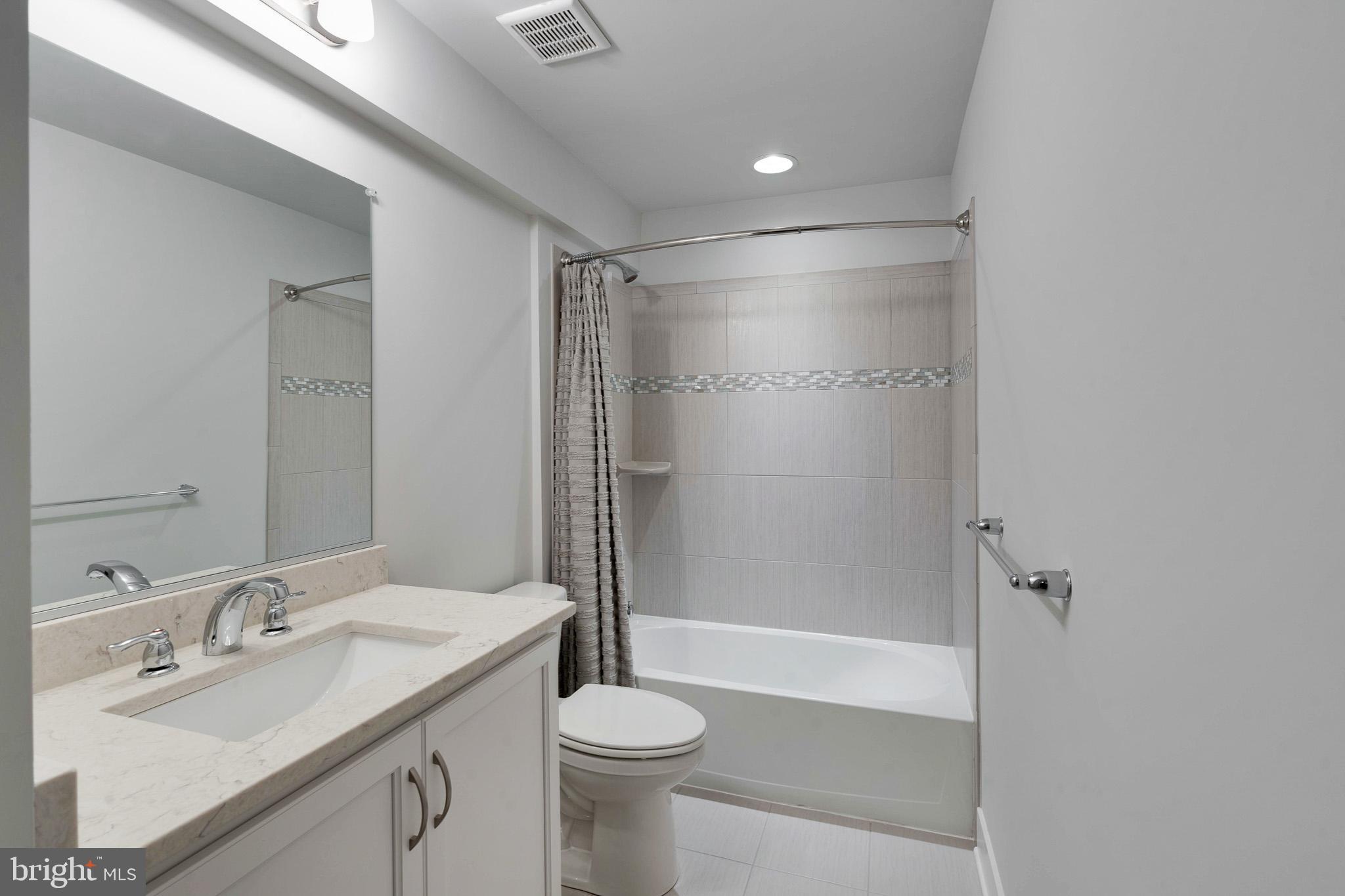 2422 Rosebud Way Fallston, MD 21047 - Photo 37 of 45 Basement Bathroom w/ Tub & Quartz Countertops