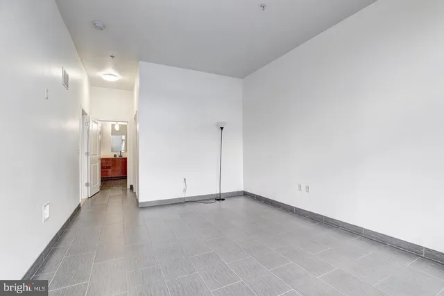 a view of an empty room with a bathroom