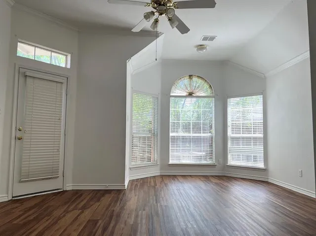 a view of a kitchen cabinets and wooden floor