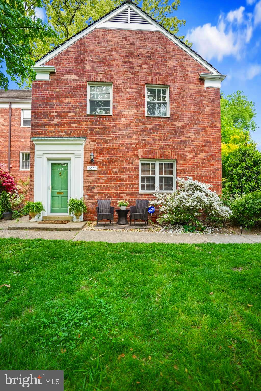 a view of house with yard