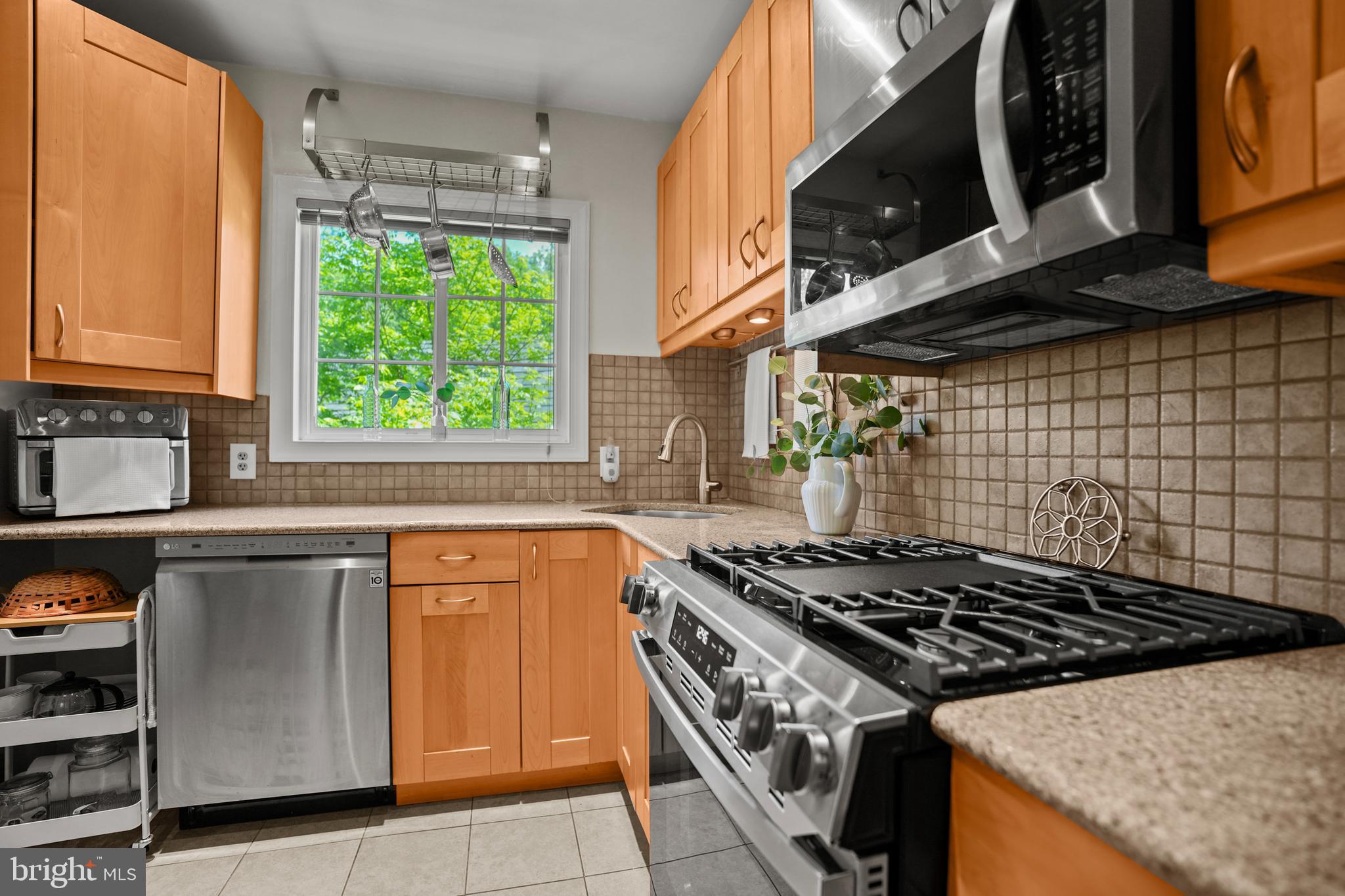 3613 Gunston Road Alexandria, VA 22302 - Photo 10 of 20 a kitchen with stainless steel appliances granite countertop a stove and a sink