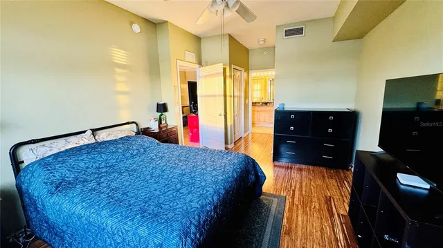 a bed room with a bed and a dresser
