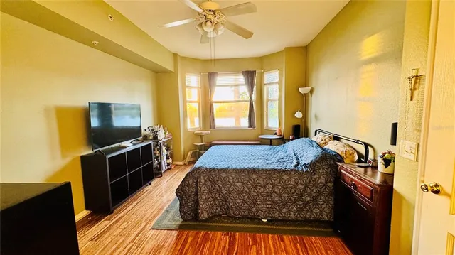 a bed sitting in a room next to a window