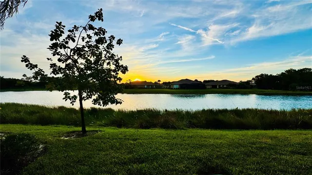 a view of a lake and a yard