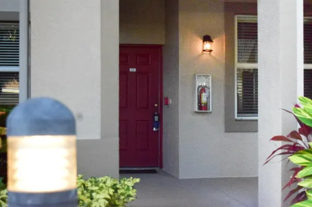 a view of hallway with paintings on the wall