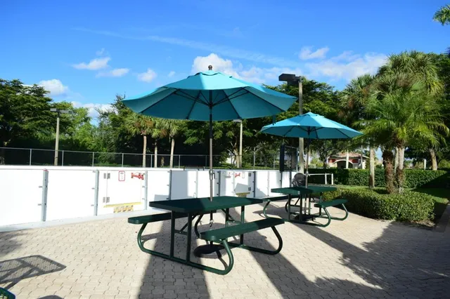 a view of swimming pool with outdoor seating