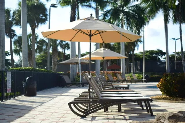 a patio table and chairs under an umbrella
