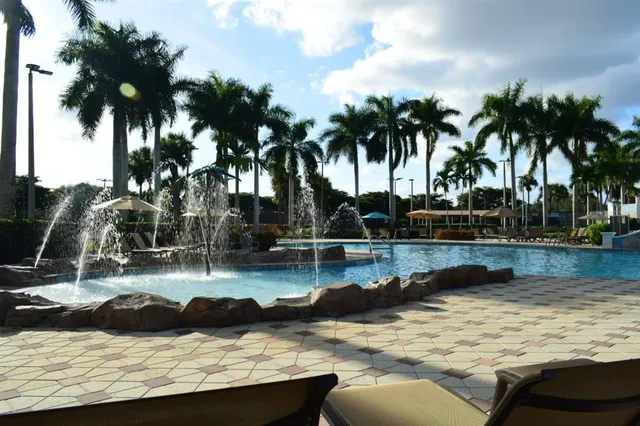 a view of a swimming pool with lounge chair