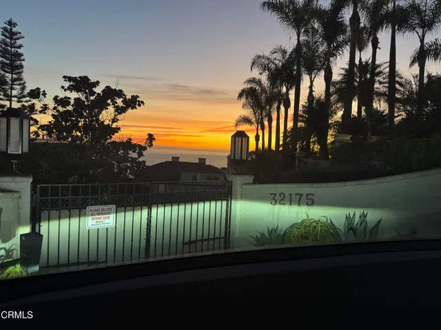 a view of a room with wooden floor and a window