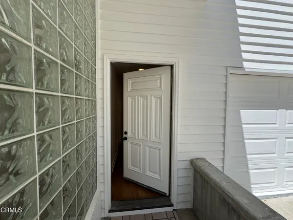 a view of entryway with wooden floor