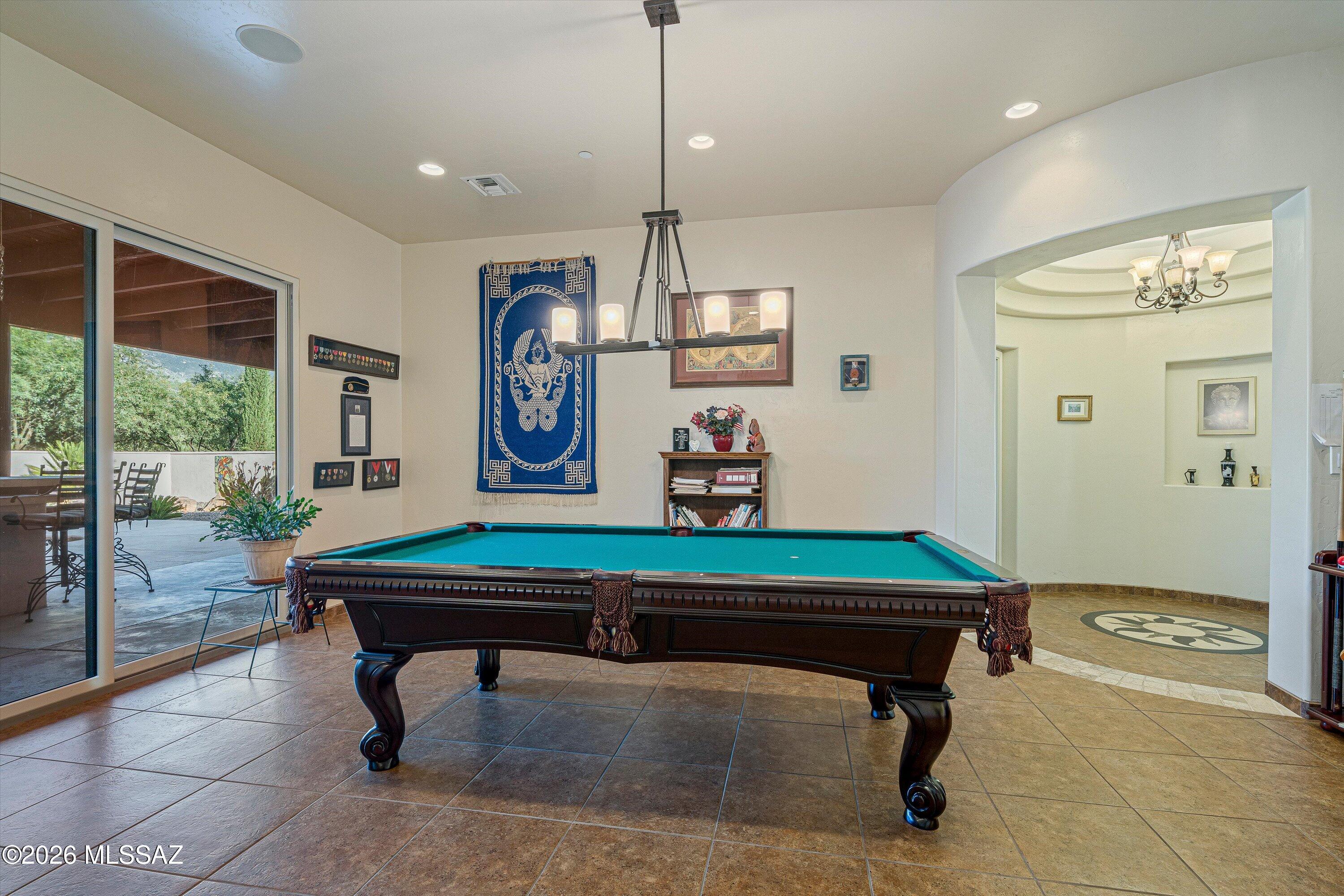 4677 East Rail N Road Tucson, AZ 85739 - Photo 22 of 48 Recreation room with patio door to backyard oasis