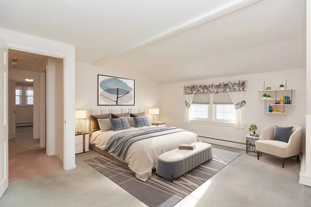 a bedroom with a bed and a couch