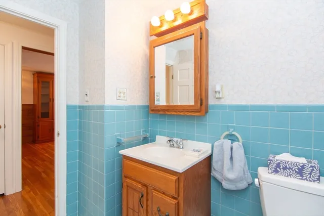 a view of water heater room with wooden ceiling