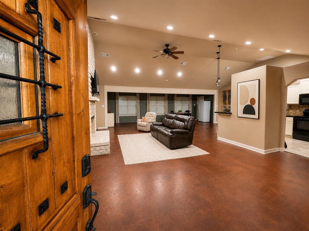 420 Sessums Road Springtown, TX 76082 - Photo 4 of 40 Front Entry into open concept living, finished stained concrete flooring-virtual art.