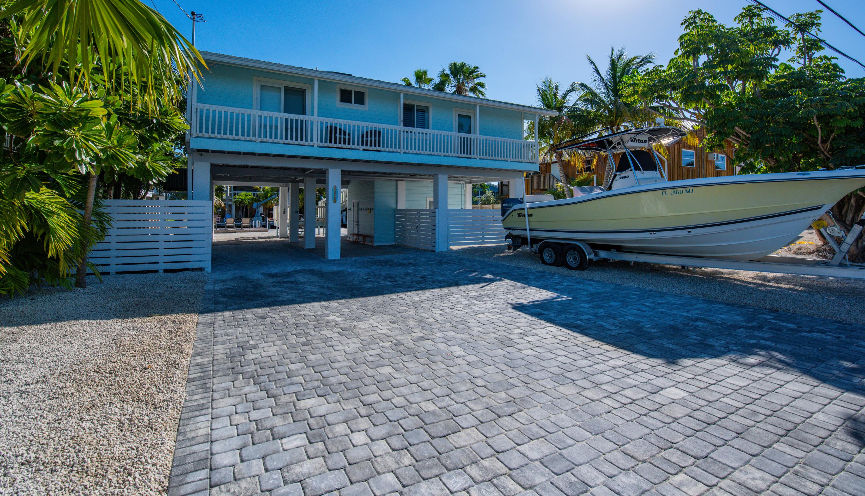 375 Pirates Road Summerland Key, FL 33042 - Photo 1 of 30 Front of Home and Gorgeous Boat