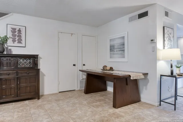 a view of a workspace with furniture