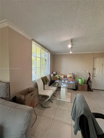 a living room with furniture and window