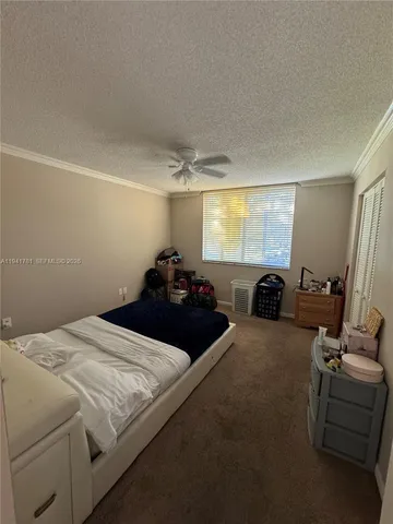 a bed room with a bed window and couch