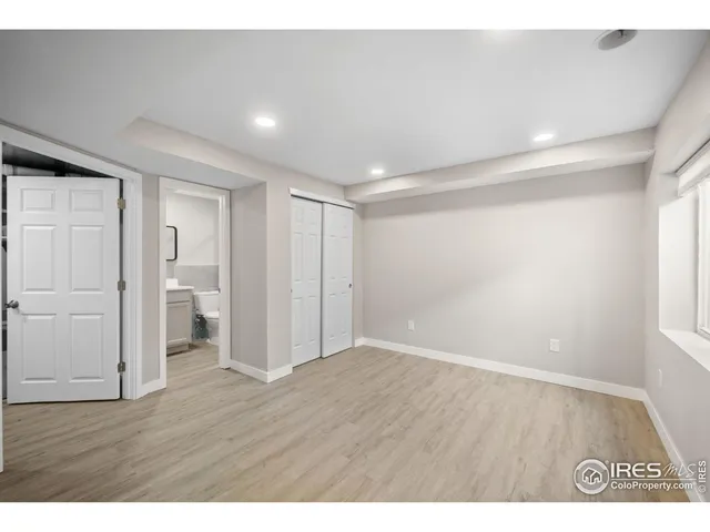 a bathroom with a sink mirror vanity and toilet