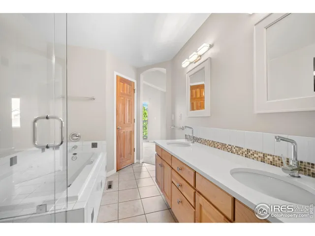 a front view of a house with a tree