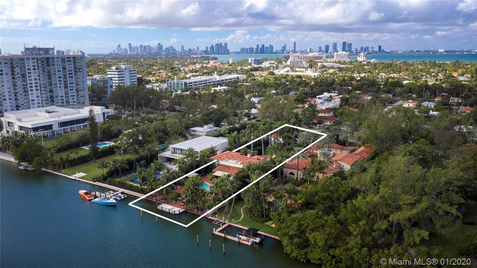4403 Pine Tree Drive Miami Beach, FL 33140 - Photo 3 of 12 an aerial view of residential houses with outdoor space and city view
