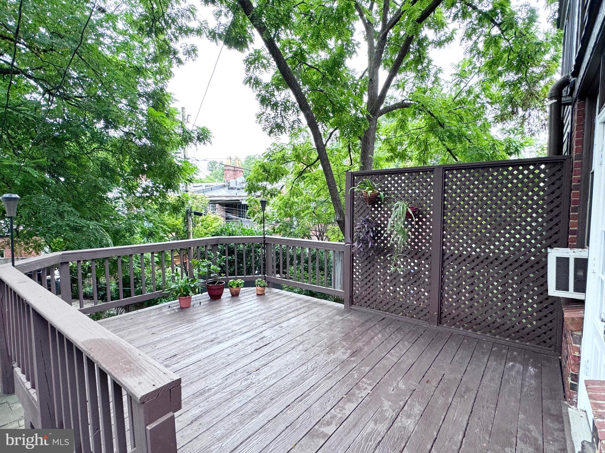 4417 Volta Place Northwest Washington, DC 20007 - Photo 32 of 38 a balcony with wooden floor and outdoor space