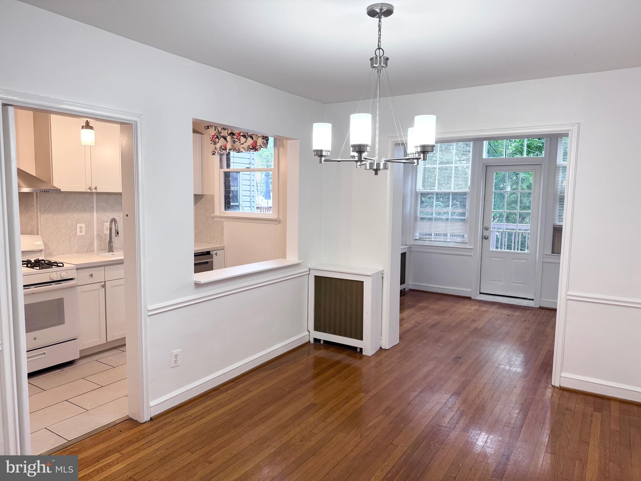 4417 Volta Place Northwest Washington, DC 20007 - Photo 9 of 38 a view of a kitchen with furniture and wooden floor