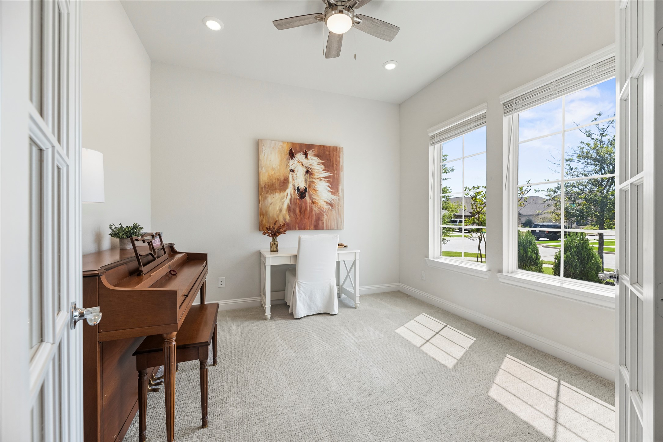 10702 Port Harrison Road Cypress, TX 77433 - Photo 12 of 44 Private study with double French doors and flooded with natural light. There is a fan and light kit and upgraded carpet.