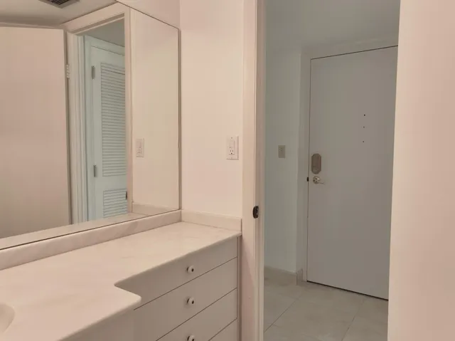 a balcony with table and chairs