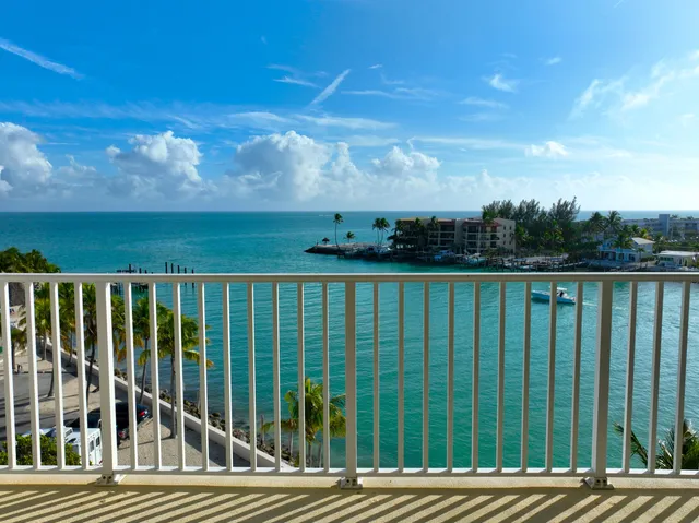 a view of swimming pool with outdoor seating and city view